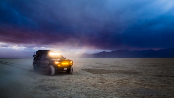 Toyota Tacoma racing offroad on the playa